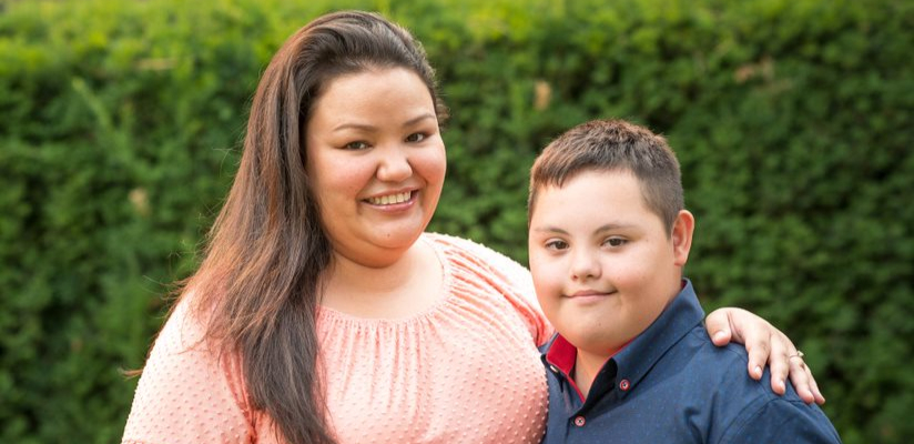Mother and son smiling.